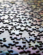 Meaning: Table top covered in puzzle pieces