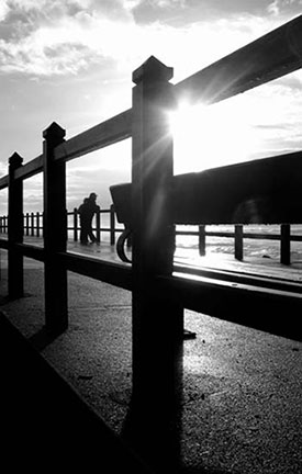 Support: Couple on pier looking out into the distance
